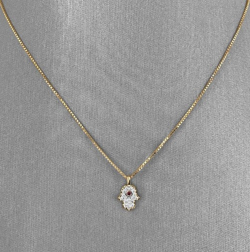 Petite Hamsa pendant in 18K yellow gold.