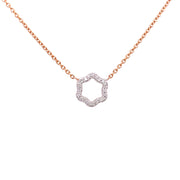 A two-tone diamond necklace featuring a hexagonal design with round brilliant cut diamonds.