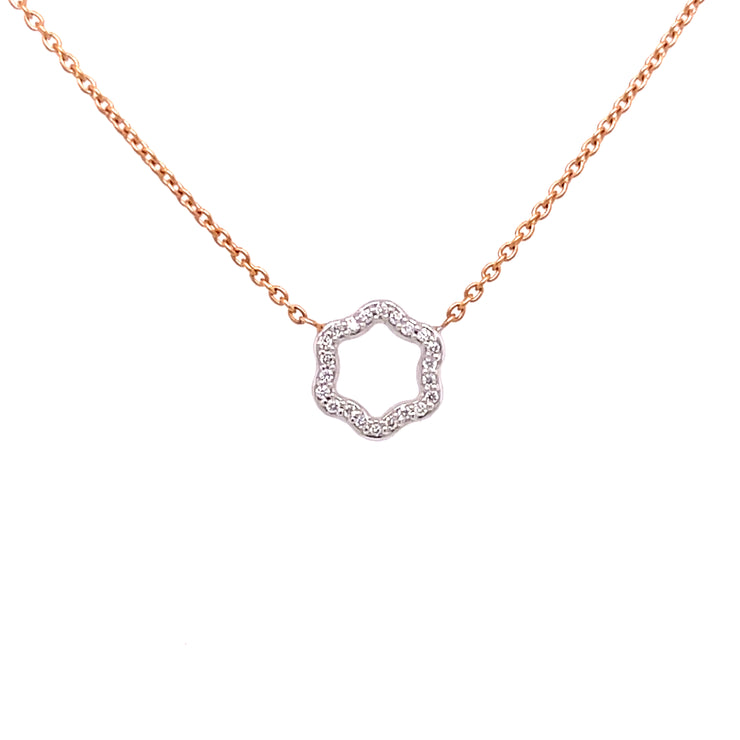 A two-tone diamond necklace featuring a hexagonal design with round brilliant cut diamonds.