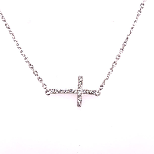 Set in polished 14K white gold, the design features 0.12 carats total weight of round brilliant cut diamonds.