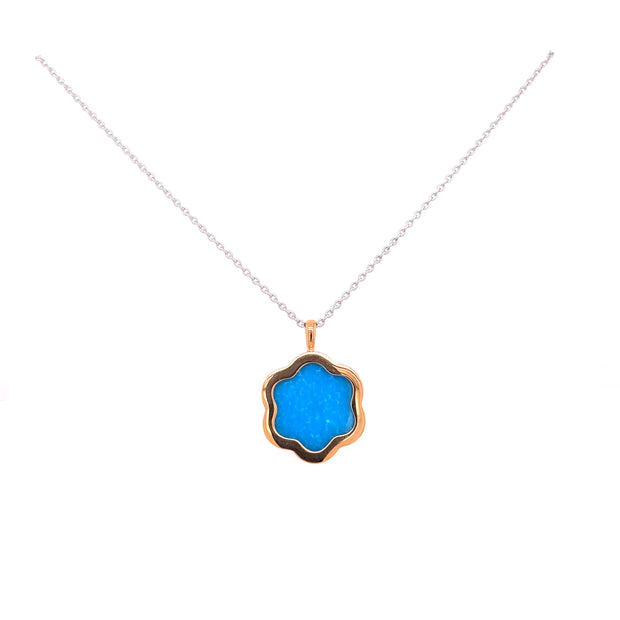 Crafted in 18K yellow gold with white gold chain for a balanced, modern design.