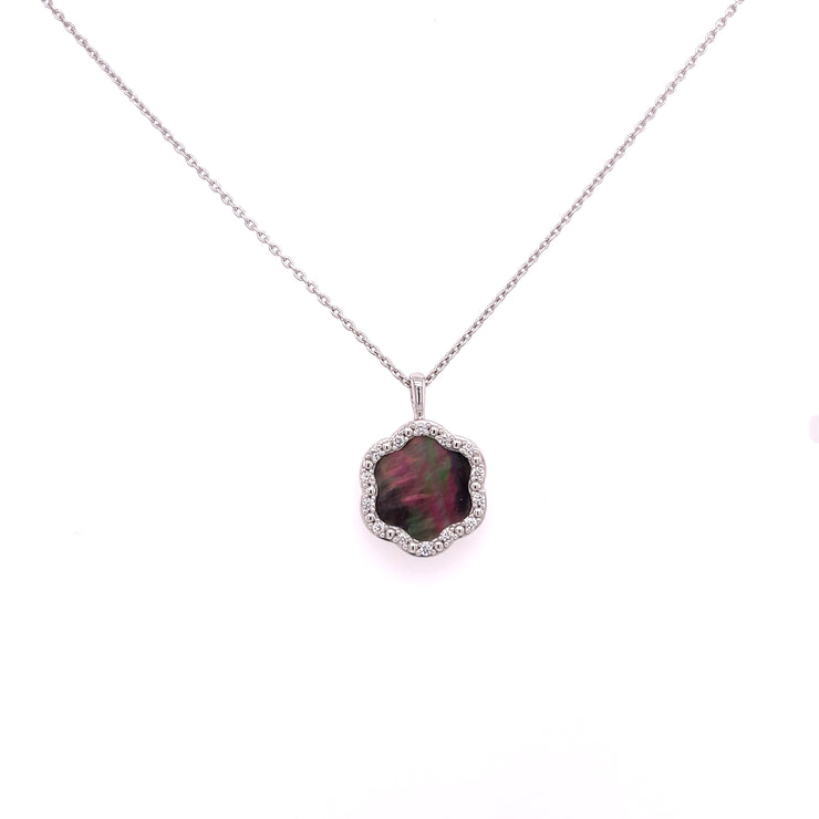 At the center a 2.96 carats of black Mother of Pearl with natural iridescence
and 0.14 carats total weight of round brilliant cut diamond accents.