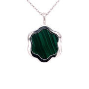  At the heart of the pendant sits 5.72 carats of richly patterned green malachite 
