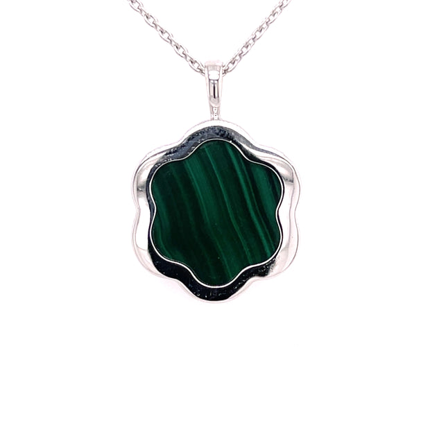  At the heart of the pendant sits 5.72 carats of richly patterned green malachite 
