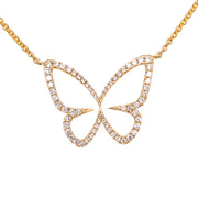 Delicate butterfly diamond necklace set in warm 18K yellow gold.