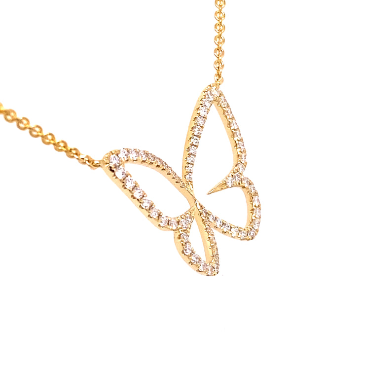 Lovely diamond butterfly necklace set in yellow gold.