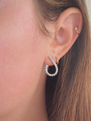 Stunning diamond teardrop hoops shown on model.