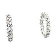 Diamond hoop earrings in white gold.