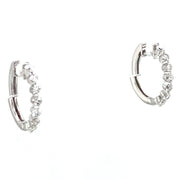 Pair of 18K white gold mini diamond hoop earrings.