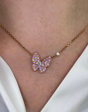 Delicate Butterfly diamond and sapphire necklace shown on model.