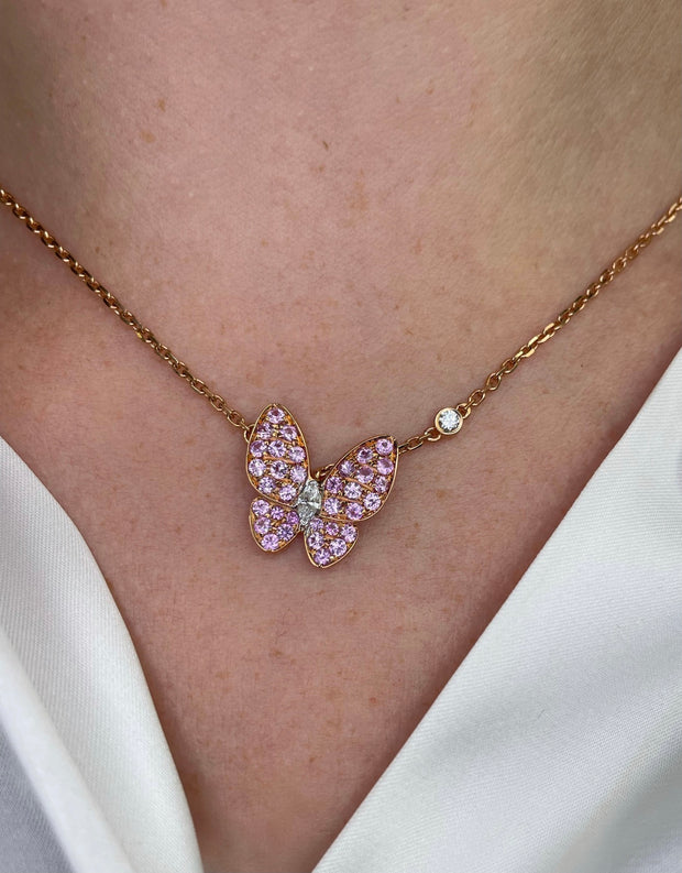 Delicate Butterfly diamond and sapphire necklace shown on model.