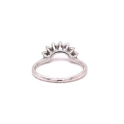 white gold and diamond arched staking ring shown form the back.