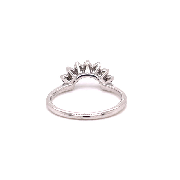 white gold and diamond arched staking ring shown form the back.