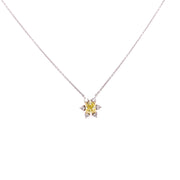 Stunning fancy yellow diamond with round brilliant accent diamonds.