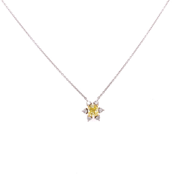 Stunning fancy yellow diamond with round brilliant accent diamonds.