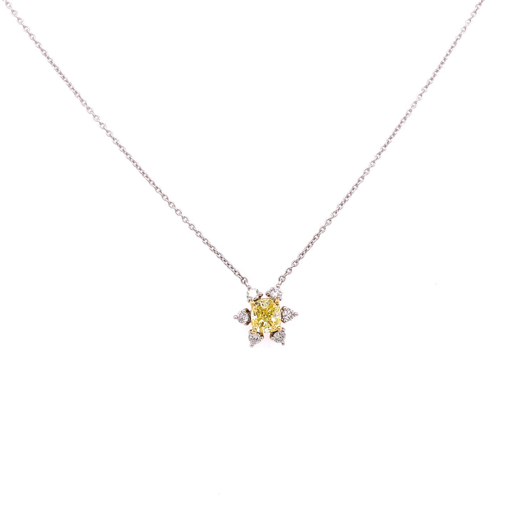 Stunning fancy yellow diamond with round brilliant accent diamonds.