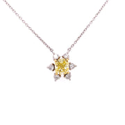 Starburst pendant necklace featuring a fancy yellow daimond at the center.