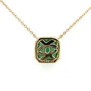 Shown from the back of the pendant we see the hallmark and intricate design.