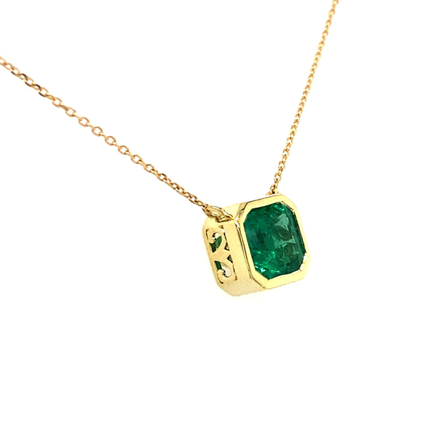 Side view of the emerald pendant.