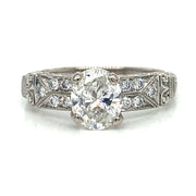 Front view showcasing the oval diamond framed by petite side stones.
