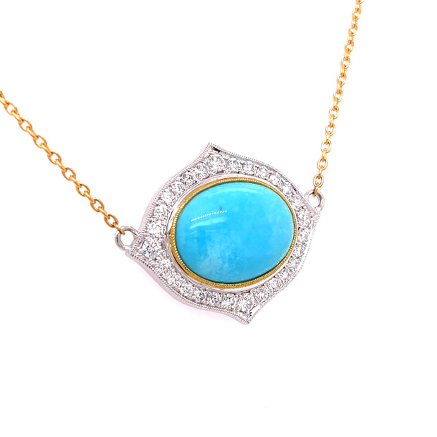 A side view of the two tone gold turquoise pendant.