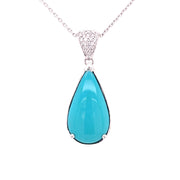 Natural Sleeping Beauty Turquoise drop pendant with diamond accented bail.