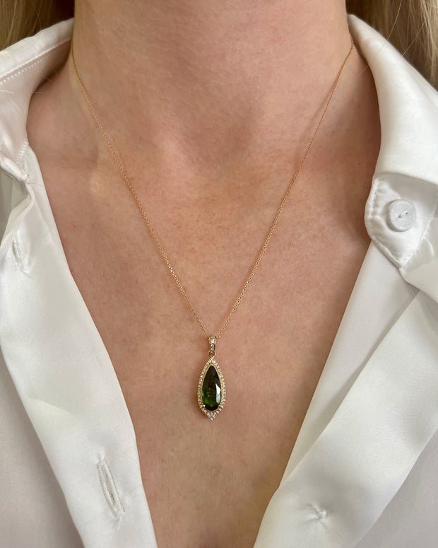 Stunnning green tourmaline and diamond pendant on model.