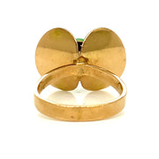 Sculptural 14K yellow gold setting with abstract butterfly-inspired design.