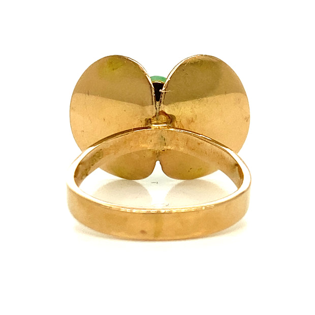Sculptural 14K yellow gold setting with abstract butterfly-inspired design.