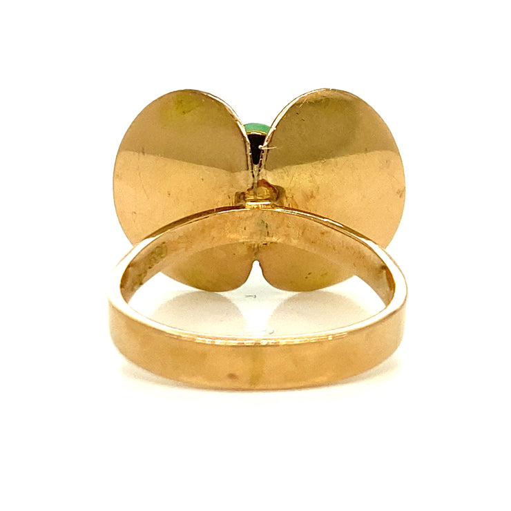 Sculptural 14K yellow gold setting with abstract butterfly-inspired design.