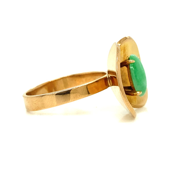 Jade and gold sculptural ring show from the side.