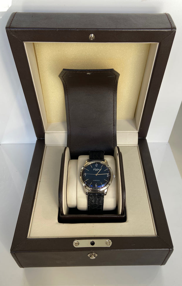 Glashütte Original Sixties watch shown with original box.