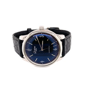 A beautifully curved black dial subtly infused with a deep blue hue. 