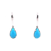 A pair of teardrop-shaped turquoise earrings set in 18K white gold.