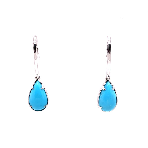 A pair of teardrop-shaped turquoise earrings set in 18K white gold.