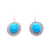 A closer look at the natural turquoise and diamond halo earrings.