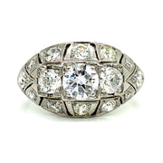 Featuring a 0.60ct European cut center diamond and 1.00ctw of side diamonds, this stunning Art Deco ring is set in 18K white gold with delicate milgrain detailing.
