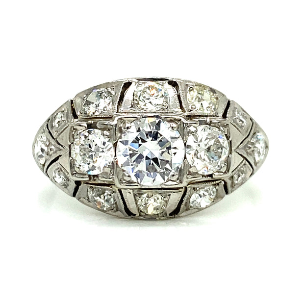 Featuring a 0.60ct European cut center diamond and 1.00ctw of side diamonds, this stunning Art Deco ring is set in 18K white gold with delicate milgrain detailing.
