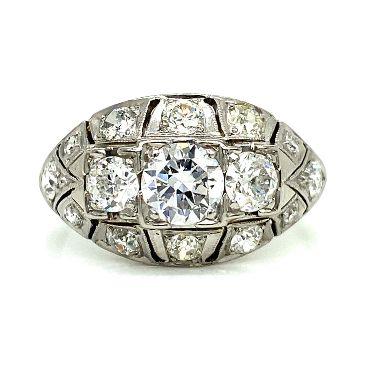 Featuring a 0.60ct European cut center diamond and 1.00ctw of side diamonds, this stunning Art Deco ring is set in 18K white gold with delicate milgrain detailing.
