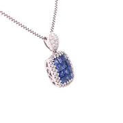 A side close view of the sapphire and natural diamond petite square pendant.