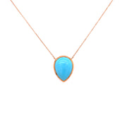 Bright blue hue of the turquoise is complemented by the warm rose gold setting.