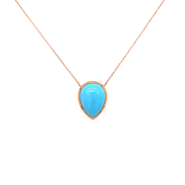Bright blue hue of the turquoise is complemented by the warm rose gold setting.