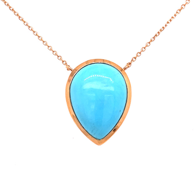 Natural sleeping beauty turquoise pendant set in 18K rose gold.