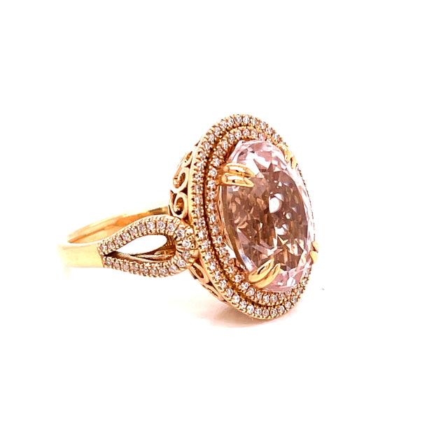 A stunning 7.45 carat oval pink Morganite at the center of this ring.