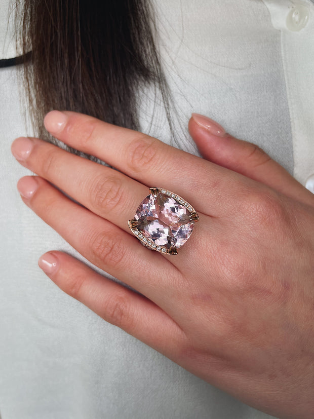 15.37 carat cushion-cut kunzite with a delicate pink hue and remarkable brilliance seen here on model.
