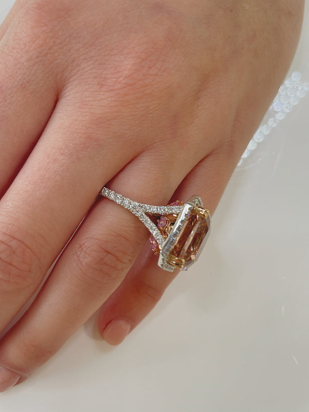 Shown slightly angled on models hand to reveal the brilliant pink sapphires set on the sides.