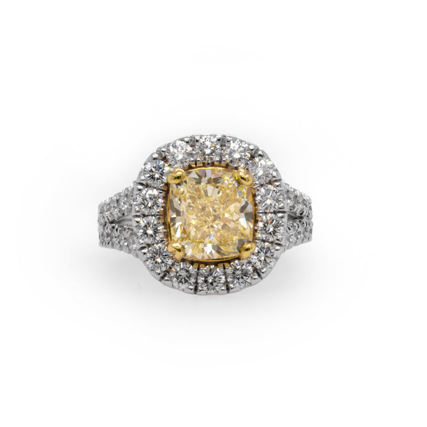 3.01 CT Fancy Yellow GIA Certified Diamond with 1.53 CTW Round Brilliant Diamonds set in a halo with 18 KYG and WG