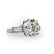 6.60 CT Round Brilliant Cut GIA Certified Diamond with 1.17 CTW Tapered Baguettes set in Platinum