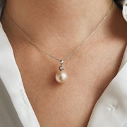 11mm South Sea pearl with bezel set diamond accent in 14k white gold.