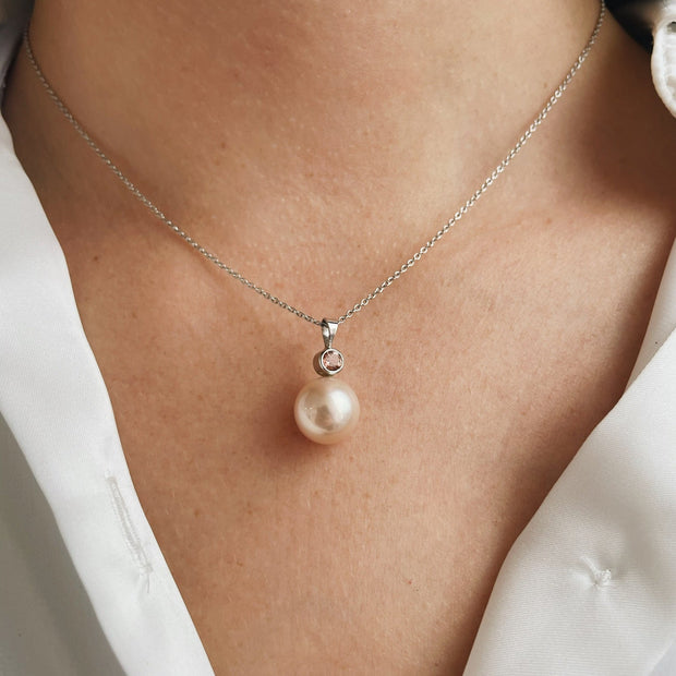 11mm South Sea pearl with bezel set diamond accent in 14k white gold.